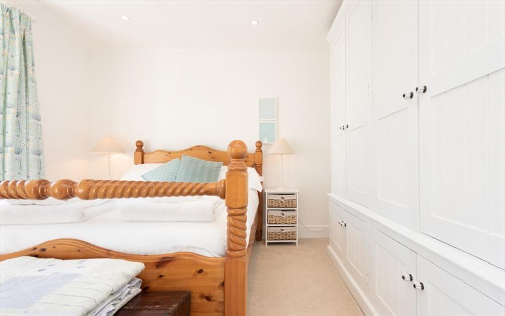 The master bedroom with plenty of clothes storage at Teak Cottage in Polperro