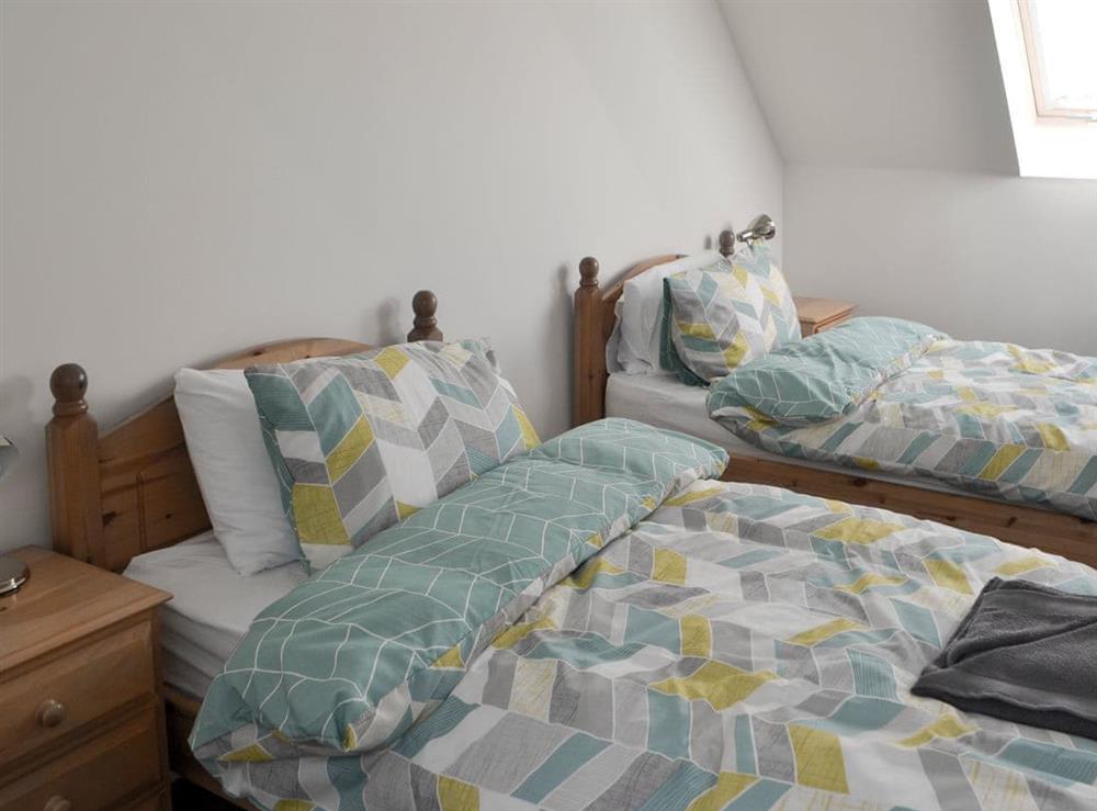 Light and airy bedroom with twin beds at Teal House in Amble, Northumberland