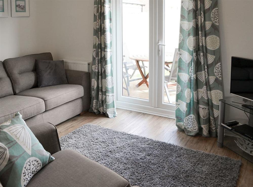 Stylishly furnished lounge at Teal House in Amble, Northumberland