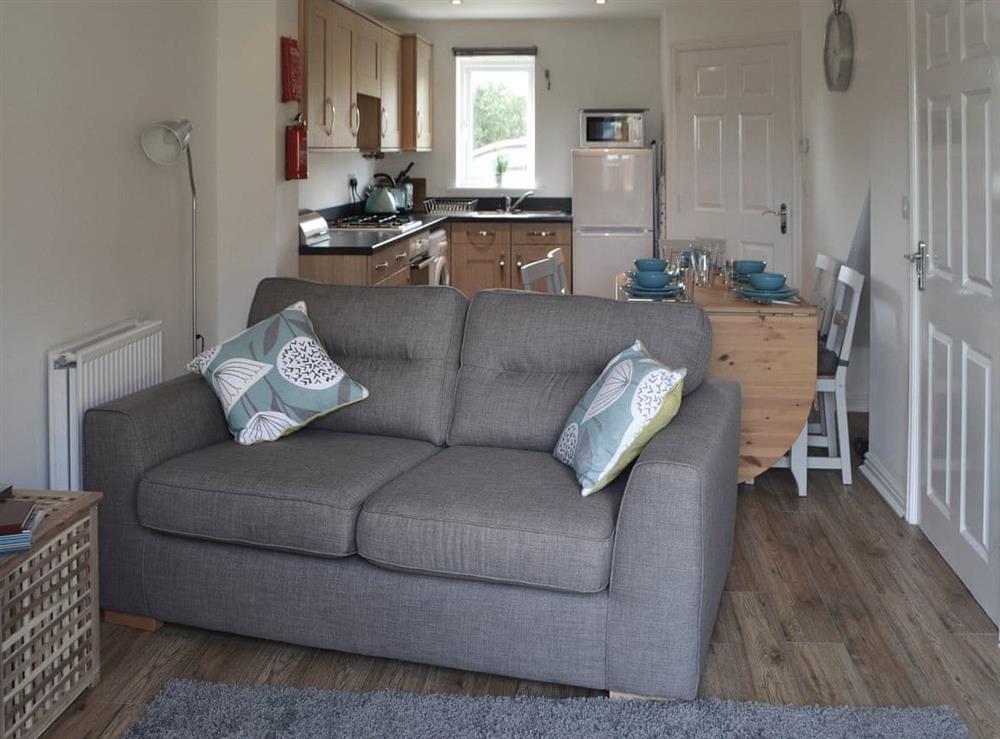Tastefully furnished open plan living space at Teal House in Amble, Northumberland