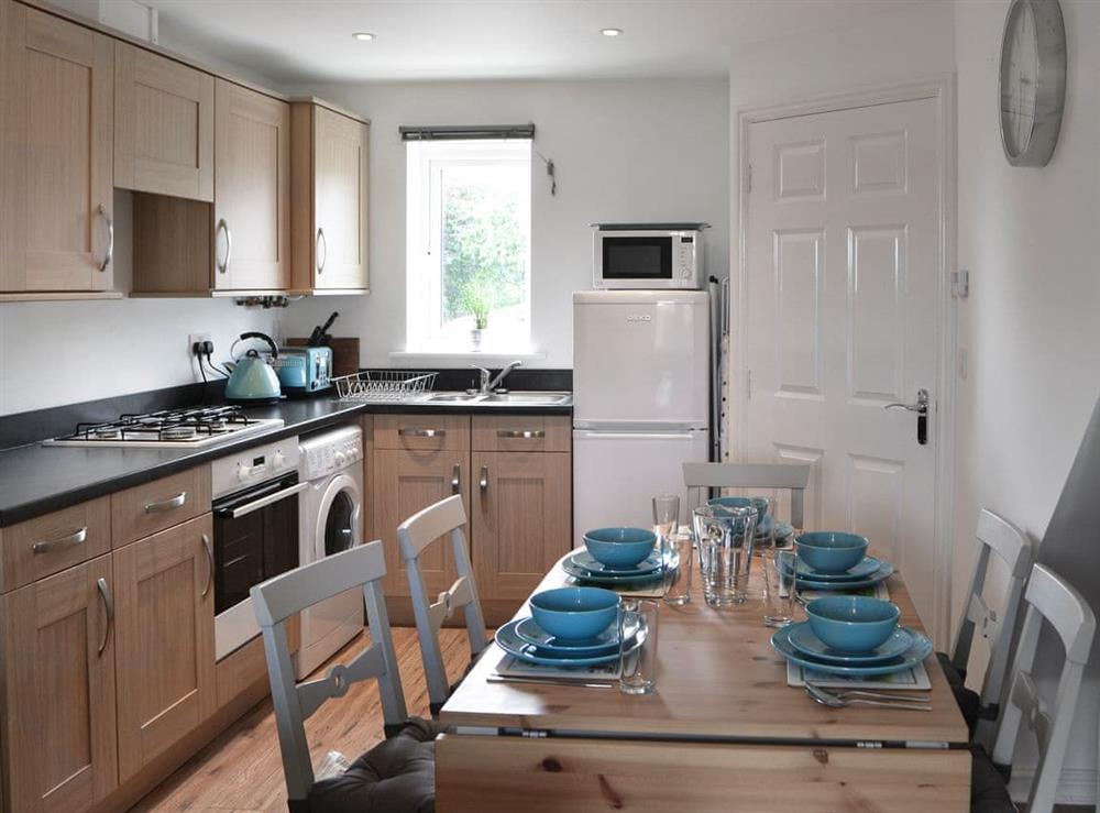 Well-equipped kitchen and dining room at Teal House in Amble, Northumberland