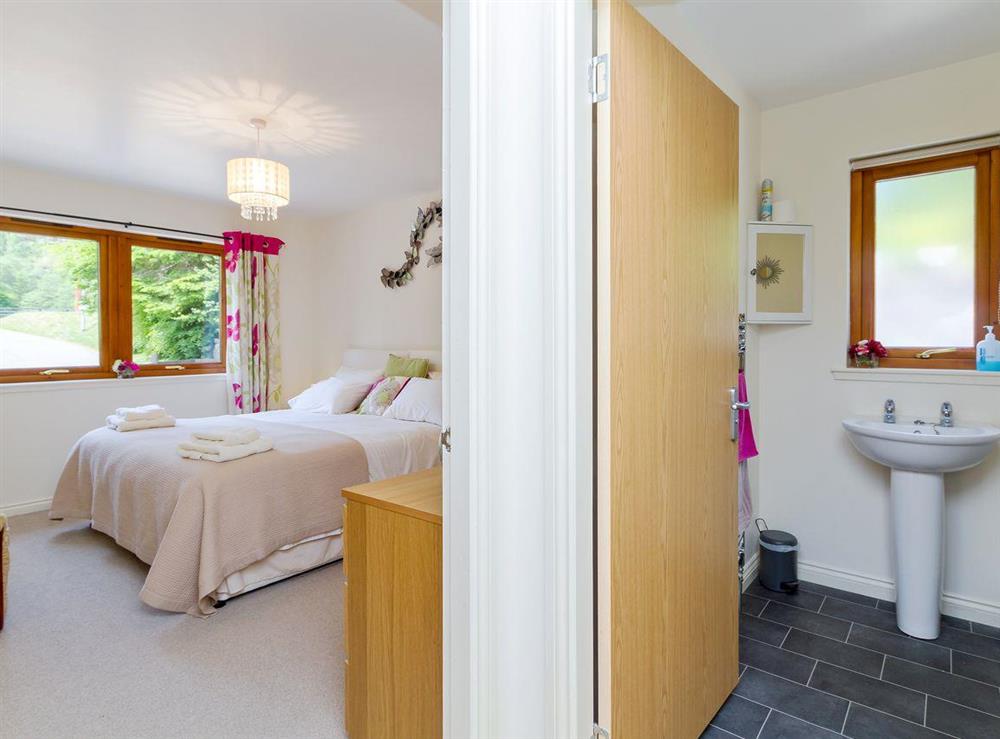 Large double bedroom and shower room at Teapot Cottage in Gairlochy, Inverness-shire