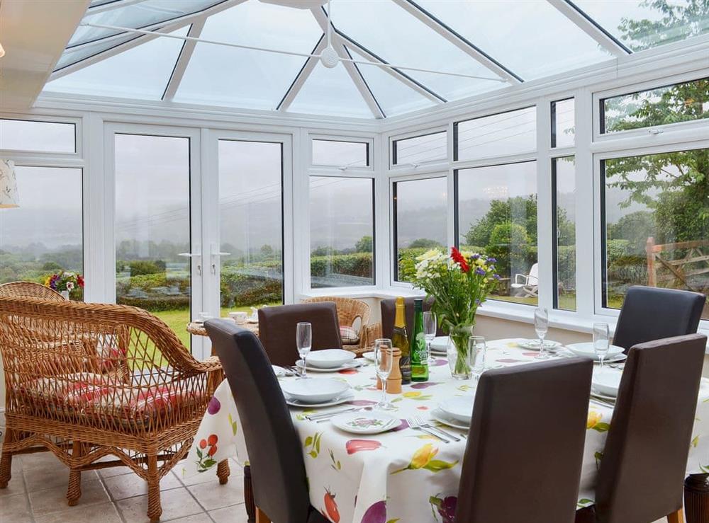 Conservatory and dining room at Tegfan in Llangenny, near Crickhowell, Powys