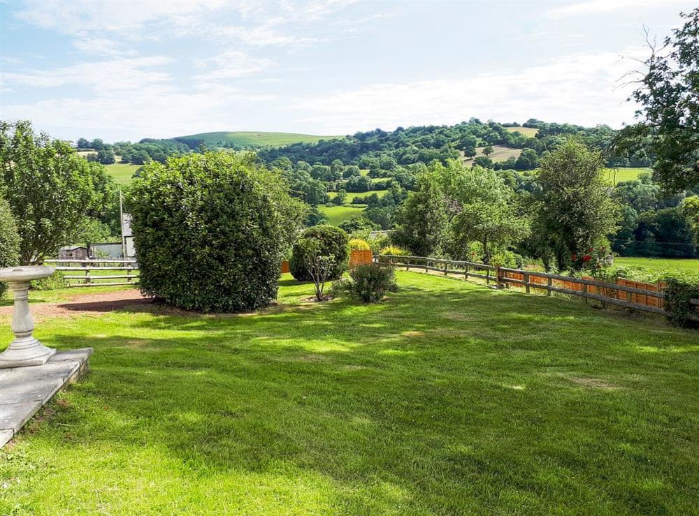 Enclosed lawned garden with garden furniture and gas BBQ at Tegfan in Llangenny, near Crickhowell, Powys