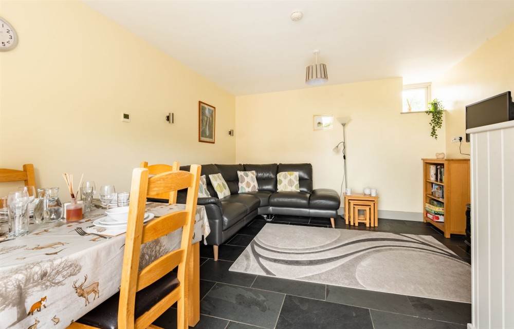 Relax in the living area at Teign Cottage in Broadhempston
