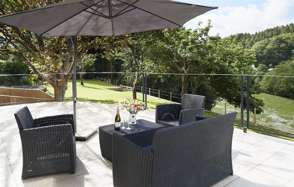 Enjoy relaxing on the elegant garden furniture and taking in the breathtaking views at Teign Vale, Drewsteignton
