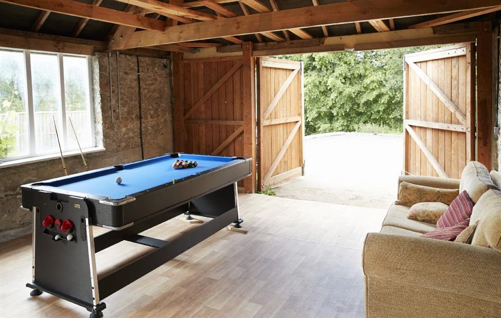 Games room with fridge, pool table, dart board (please bring your own darts), television and comfy chairs