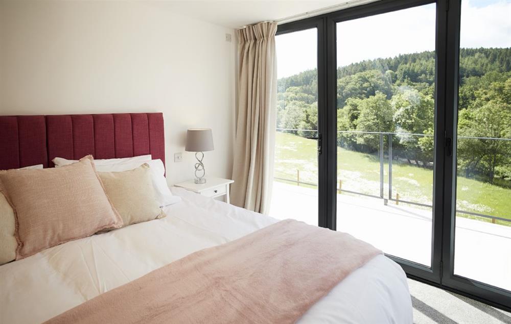 King size bedroom with en-suite shower and beautiful views at Teign Vale, Drewsteignton