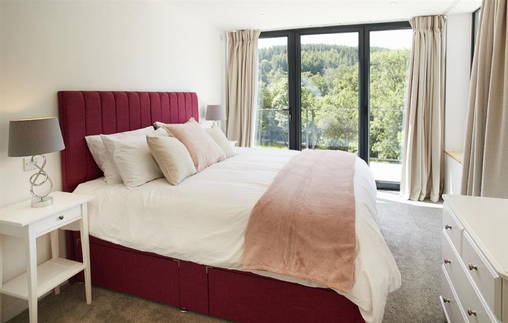 King size bedroom with en-suite shower and Ground floor: King size bedroom with en-suite shower and and bi-fold doors onto stunning views