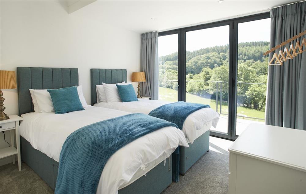 Super king size bed with en-suite and bi-fold doors onto stunning views at Teign Vale, Drewsteignton