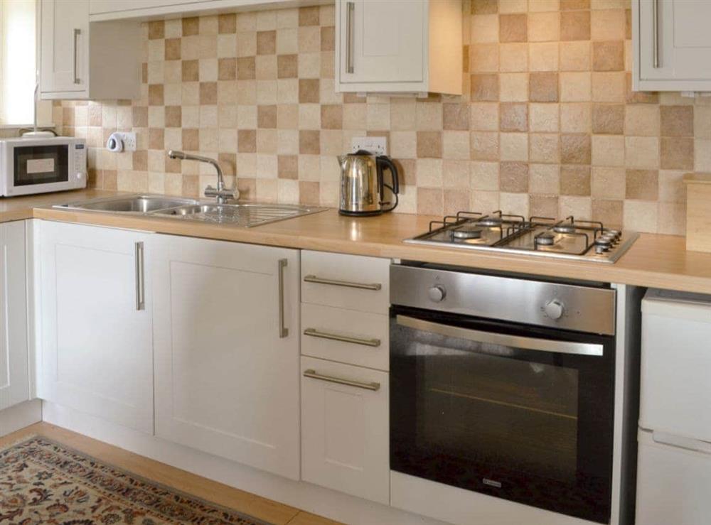 Well equipped kitchen area at Temple House West in Drumnadrochit, Inverness-Shire