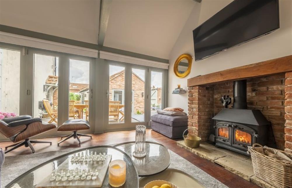 Sitting room with wood burning stove and Smart television with Sky