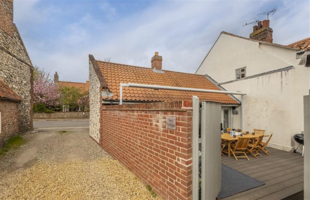 Tern Cottage is accessed via a shingled loke