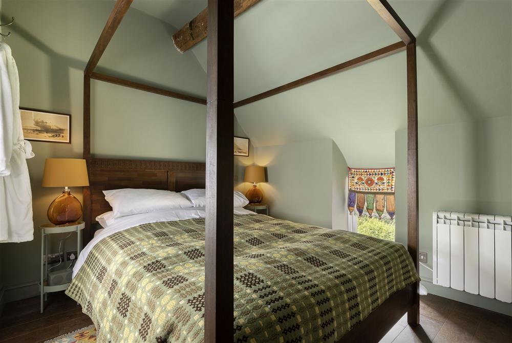 The bedroom, on the second floor, with 5’ king-size bed at Tetbury Cottage, Tetbury