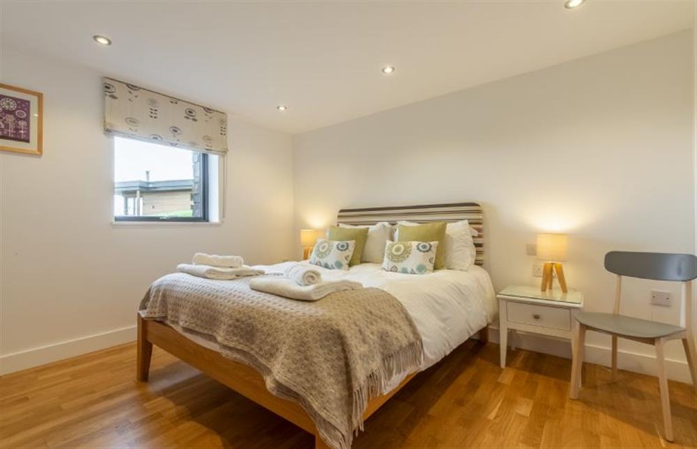 Bedroom two with king-size bed, en-suite and sea views at Teyr Mor Cliff, Chapel Porth, St Agnes