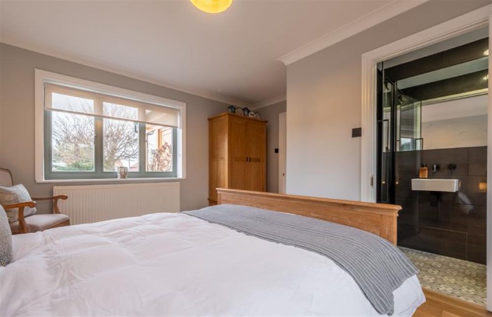 Ground floor: Master bedroom through to en-suite at Thainstone House, Brancaster near Kings Lynn
