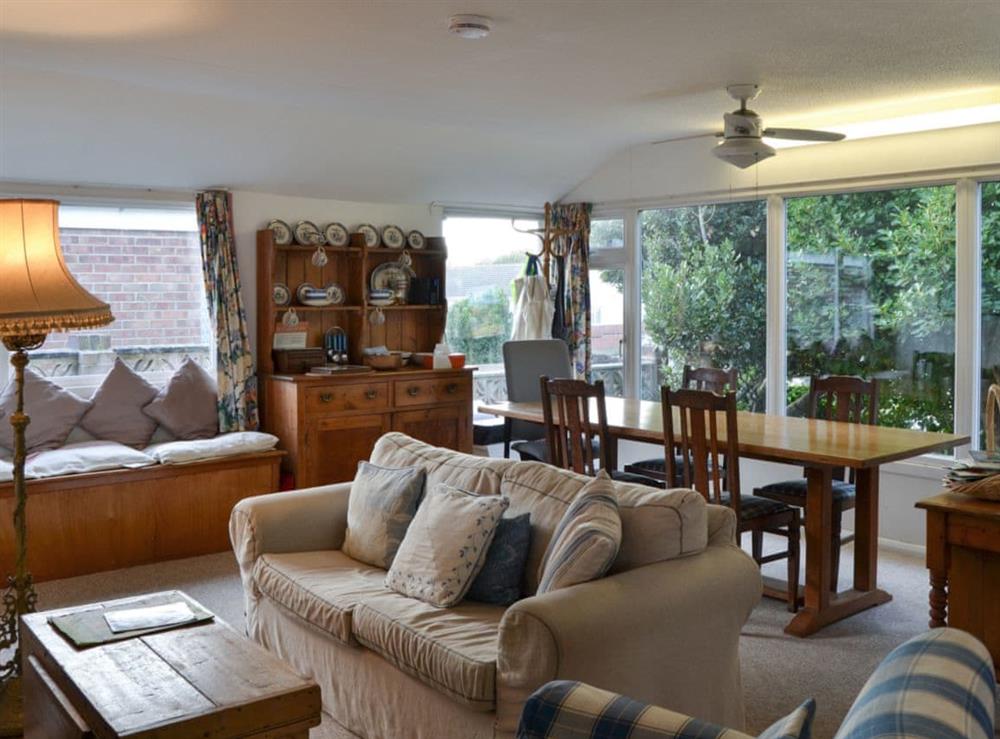 Living room with dining area at Thalassa in Pagham, near Chichester, West Sussex