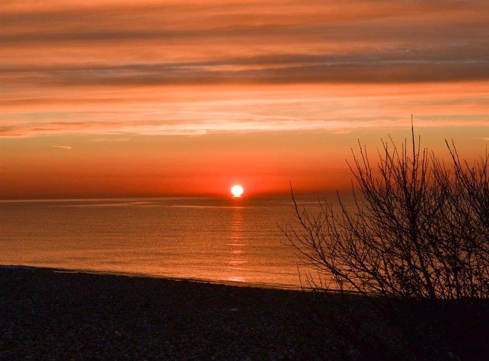 Spectacular sunset as seen from the bedroom window at Thalassa in Pagham, near Chichester, West Sussex