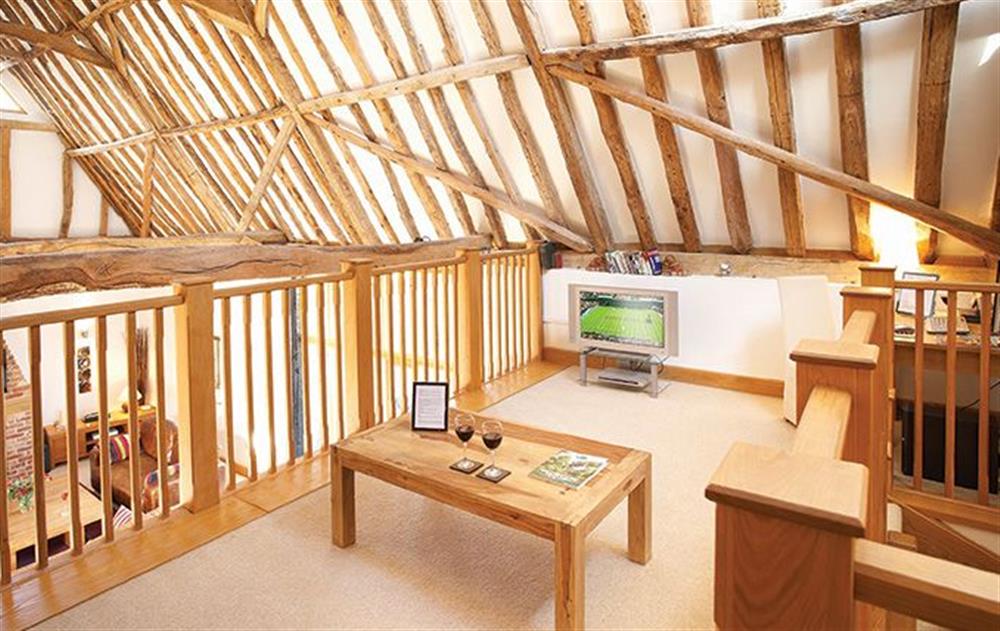 First floor:  Mezzanine level with double 4'6 sofa bed sleeping two guests at Thatch Barn, Buringham Green