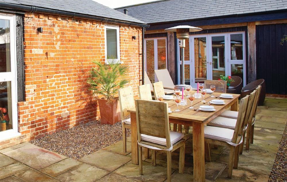 Patio and outdoor dining area at Thatch Barn, Buringham Green