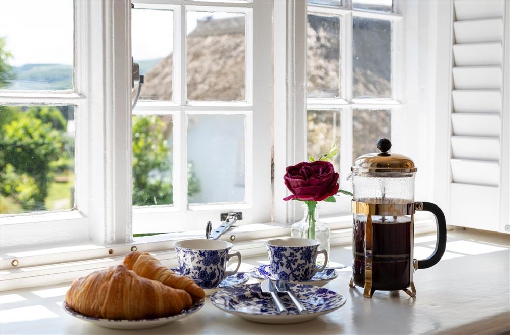 A cafetiere and croissant