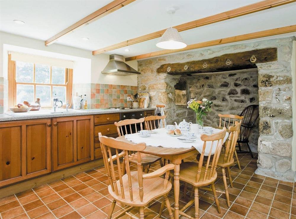 Well equipped kitchen/dining room with beams at Thatch Cottage in Rosudgeon, near Marazion, Cornwall
