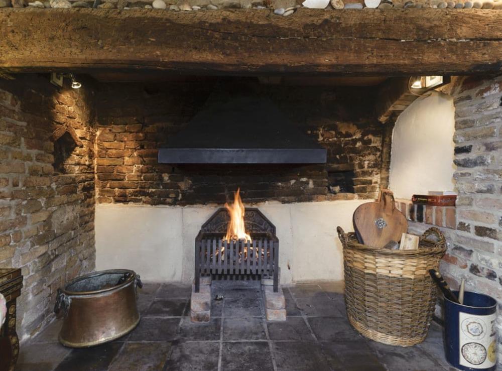 Traditional living room with open fire (photo 2) at Thatched Cottage in Sternfield, near Aldeburgh, Suffolk
