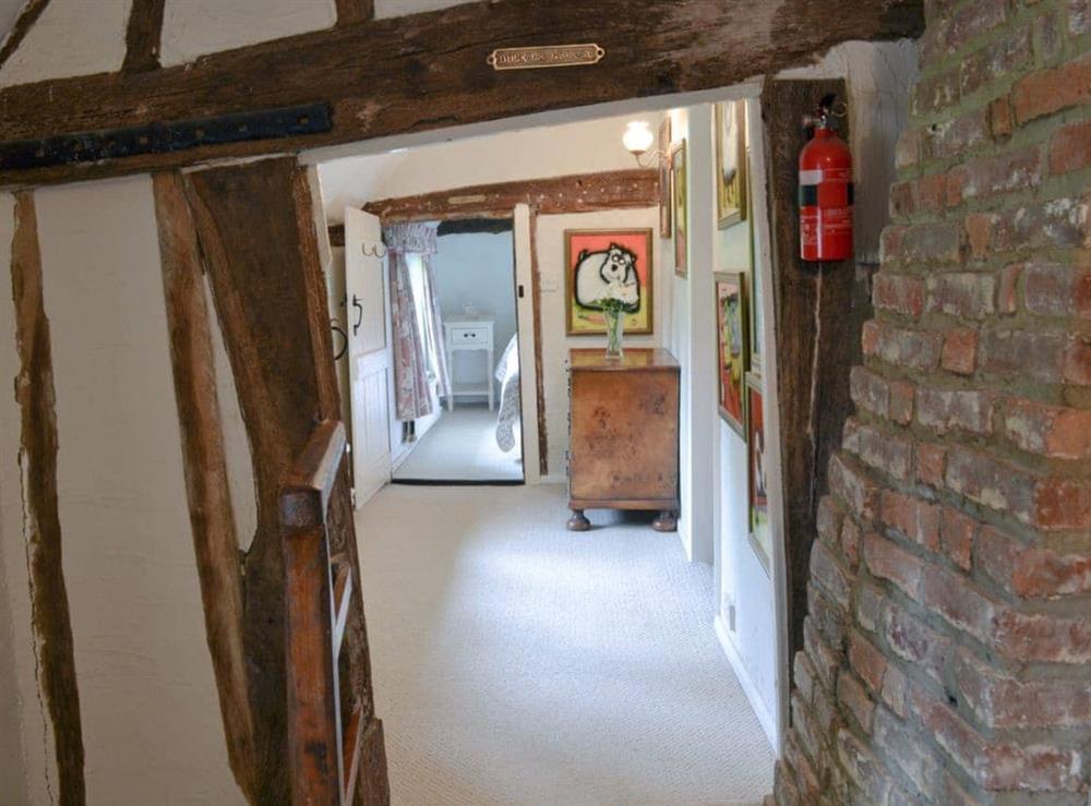 Beamed landing with low ceiling at Thatched Cottage in Steven’s Crouch, near Battle, East Sussex