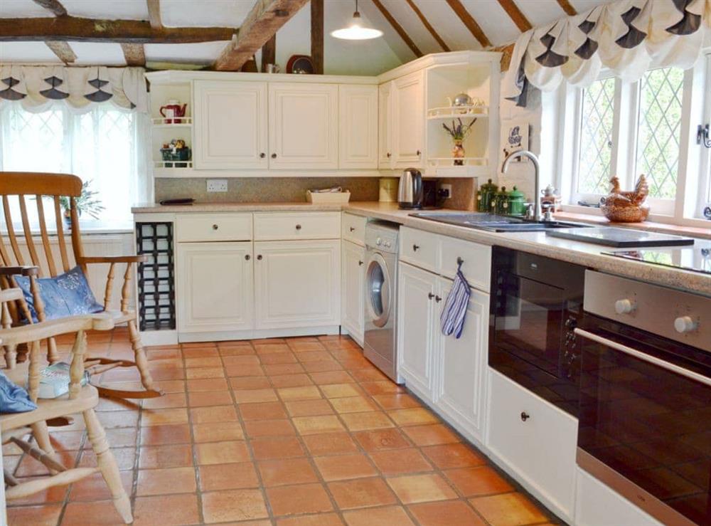 Well equipped kitchen with character at Thatched Cottage in Steven’s Crouch, near Battle, East Sussex