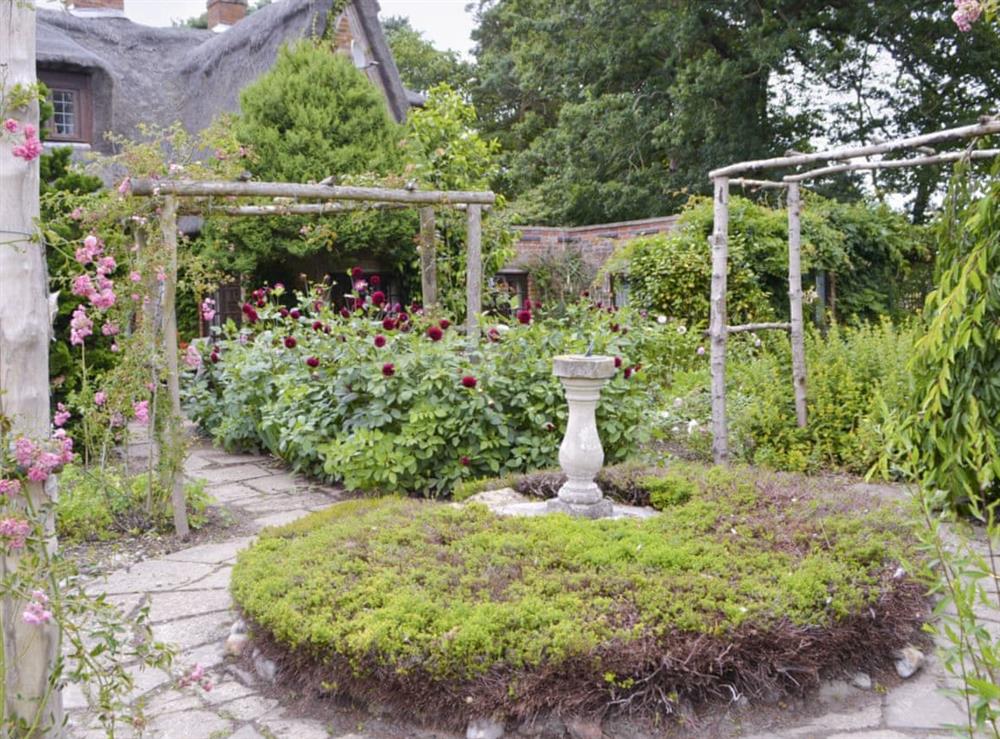 Meticulously maintained gardens at Thatched Cottage in Witton, near North Walsham, Norfolk