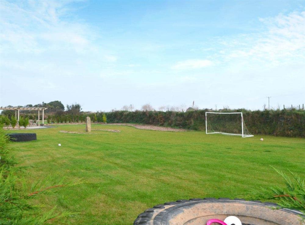 Large, spacious garden and grounds with childs play equipment at Pentowan Farm, 