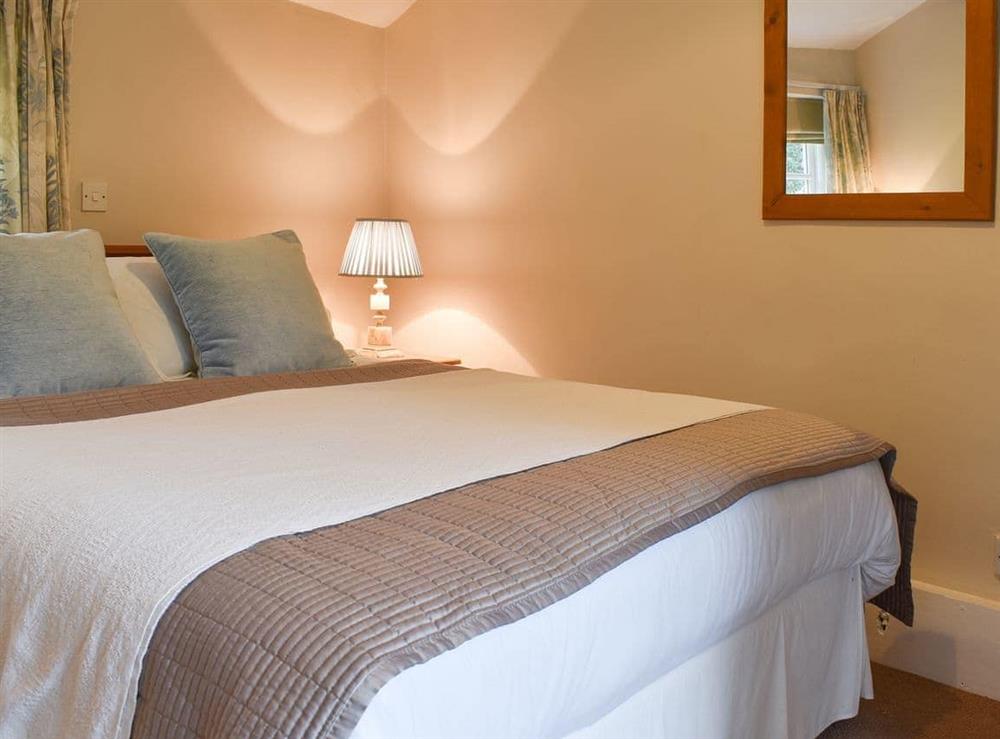 Welcoming bedroom with large bed at The Farriers, 