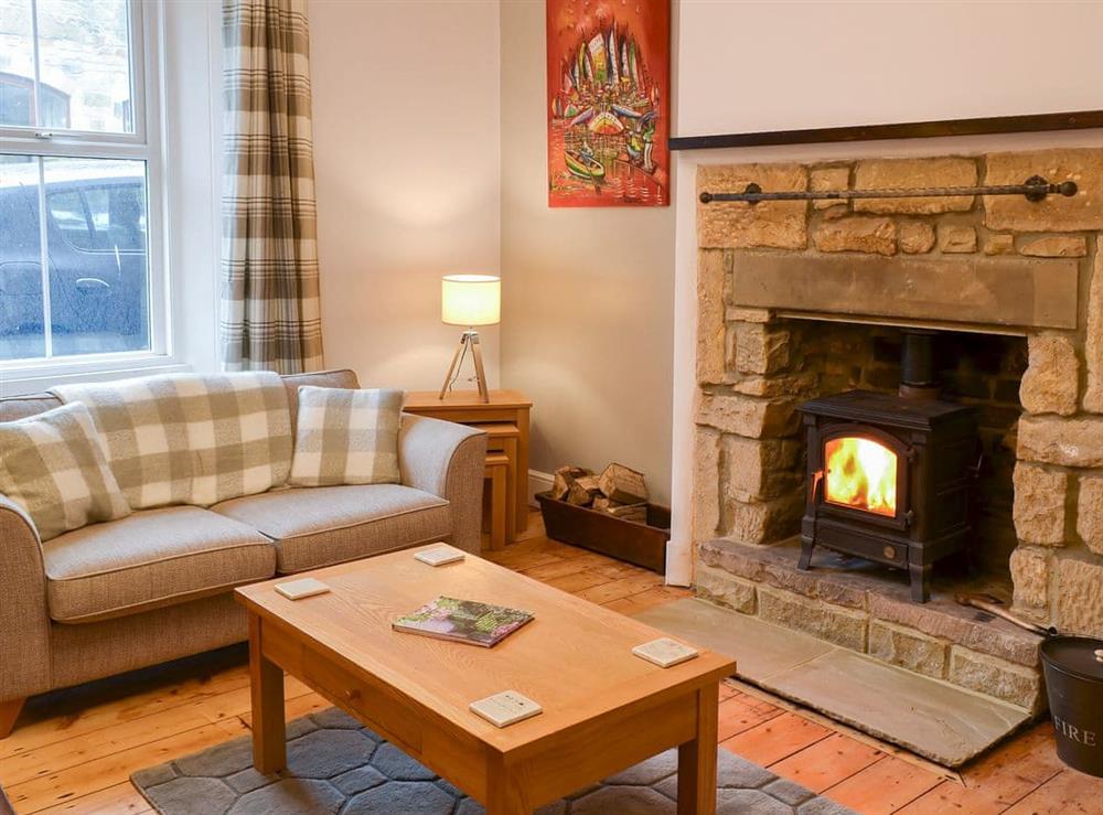 Cosy living room with wood burner at The Anchorage in Alnwick, Northumberland