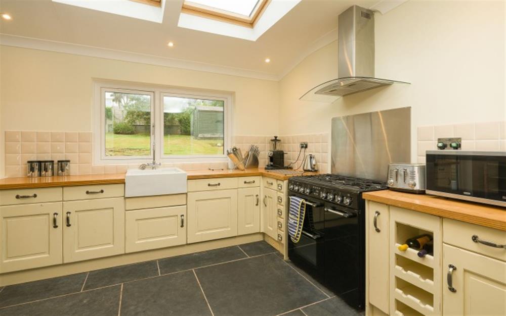 Views over the garden from the kitchen and a good quality range cooker with gas hob. at The Anchorage in Beesands