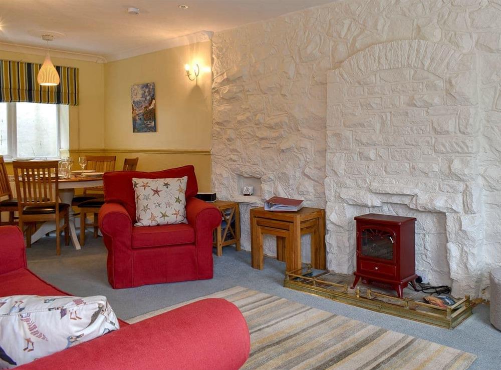 Attractive living room with dining area at The Anchorage in Staithes, near Whitby, Cleveland