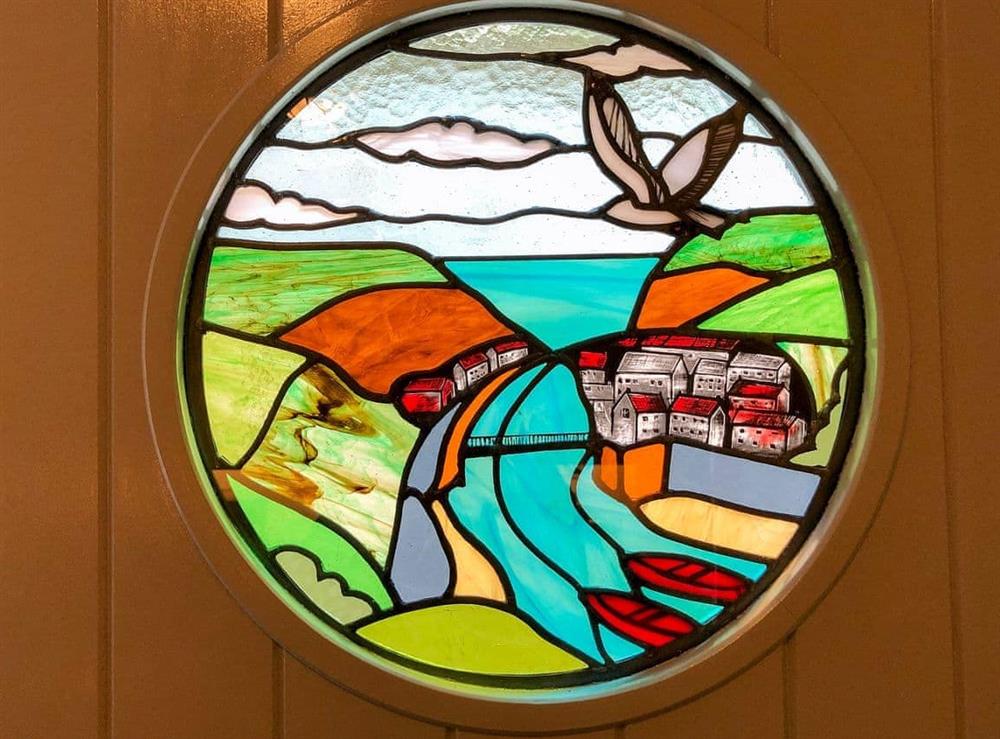 Feature, stained glass window in the kitchen door at The Anchorage in Staithes, near Whitby, Cleveland