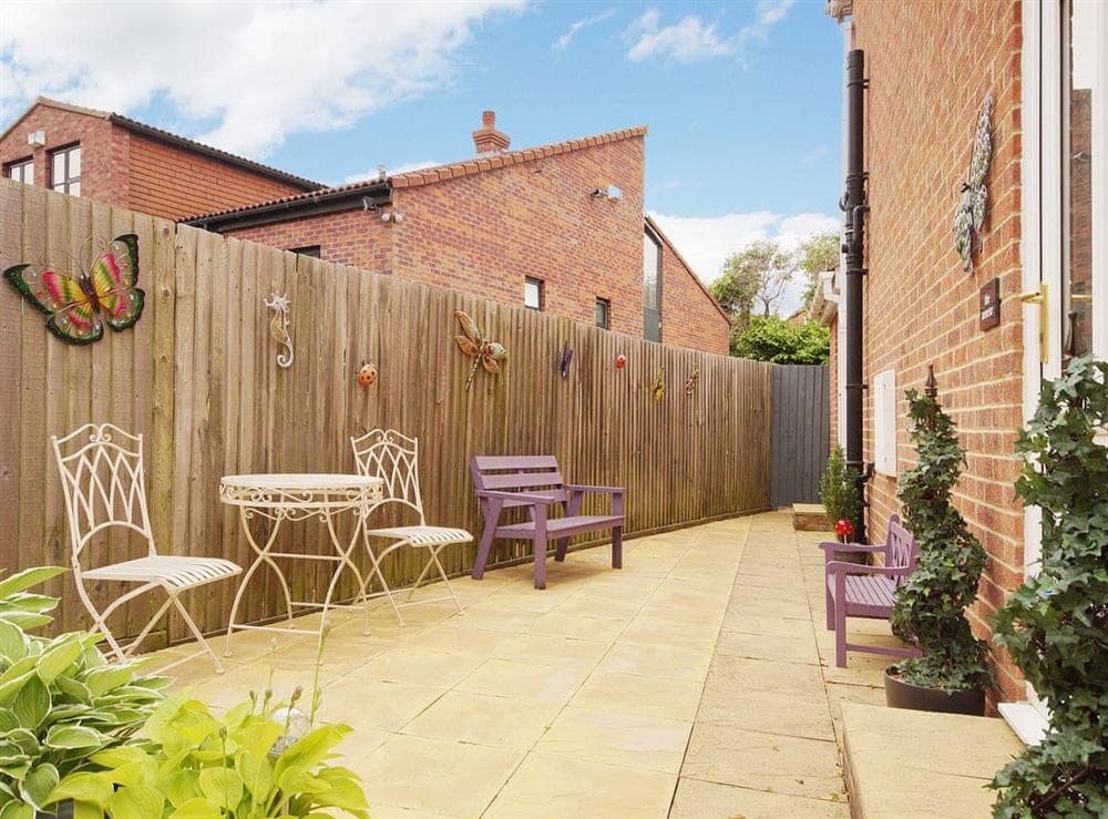 Paved patio area with outdoor furniture at The Annexe in Knaresborough, North Yorkshire