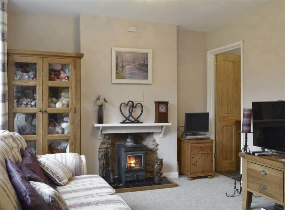 Welcoming living room with wood burner at The Annexe in Neenton, near Bridgnorth, Shropshire
