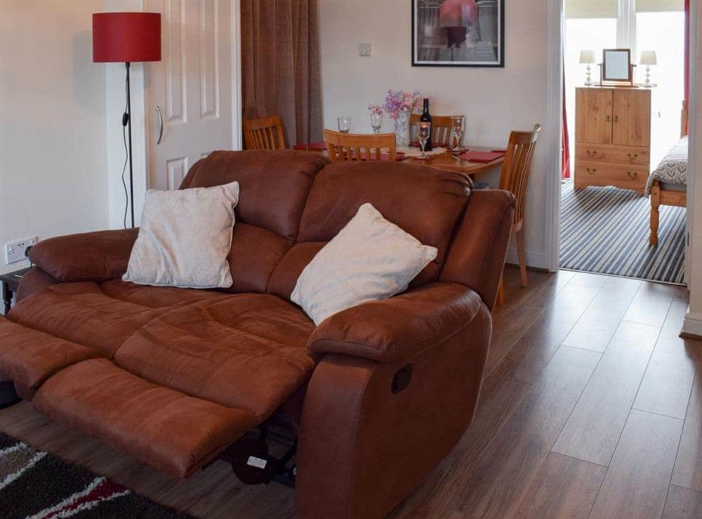 Living room with reclining sofa at The Annexe in Whitby, Yorkshire, North Yorkshire