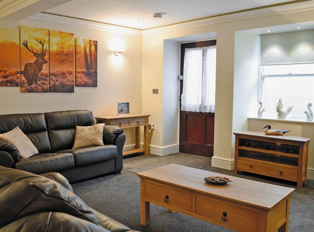 Living/dining room with sofa bed at The Apartment in Coldstream, Berwickshire