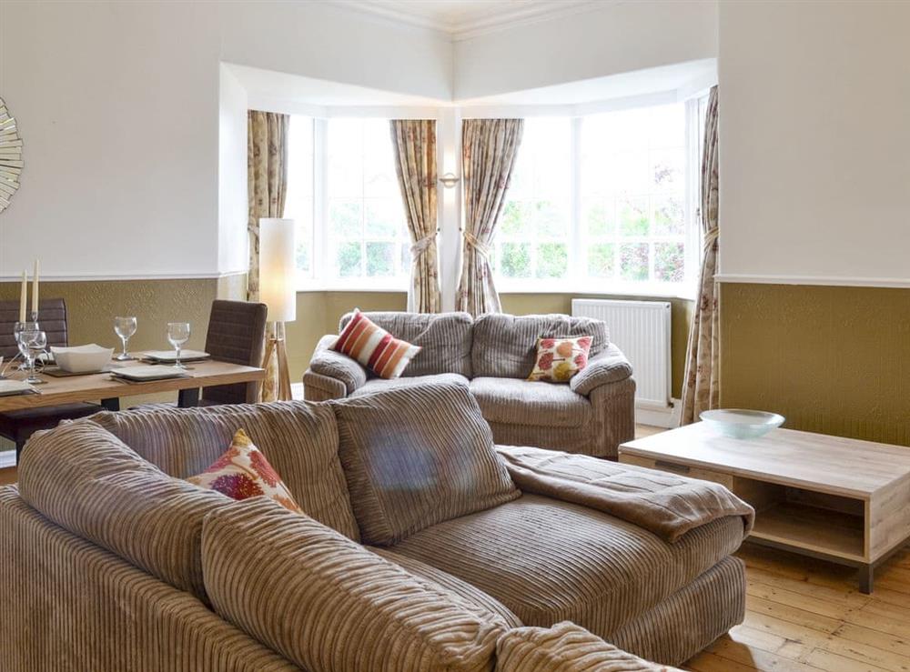 Large living room with convenient dining area at The Arches in Scarborough, North Yorkshire