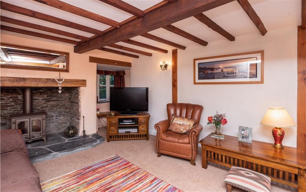 Another look at the lounge with log burner for those cooler days and romantic atmosphere. at The Arches Whole House in Slapton