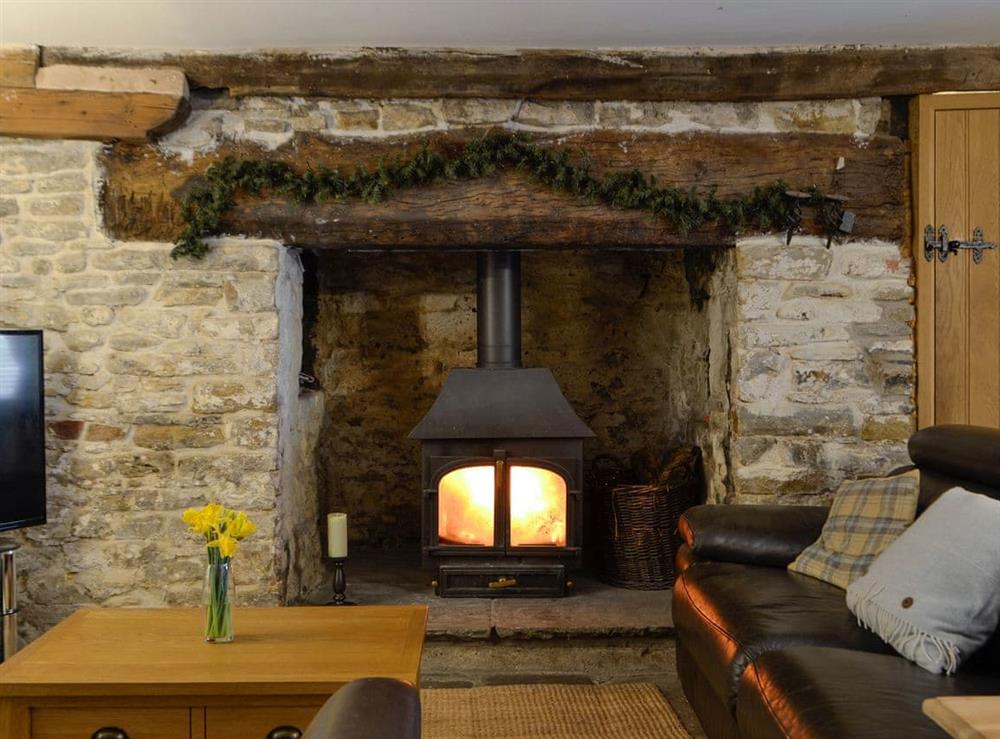 Welcoming living area with wood burner at The Bake House in Bettws, Mid Glamorgan