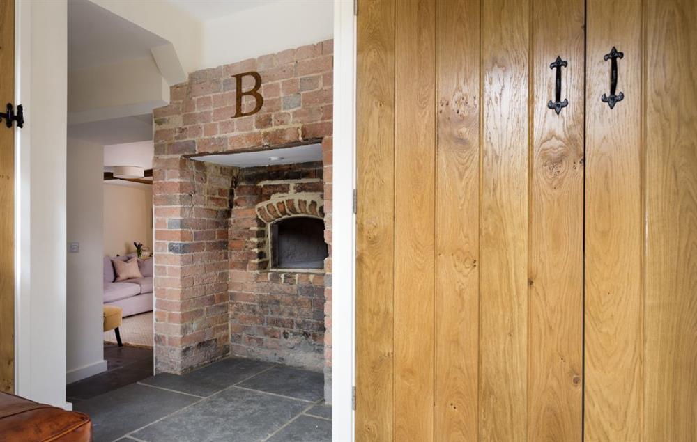 Entrance hall with original bread oven at The Bakery, Stretton-on-Fosse