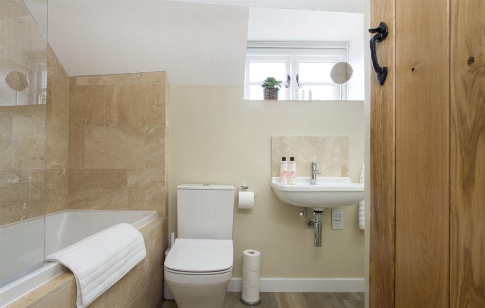Family bathroom with bath and shower over at The Bakery, Stretton-on-Fosse