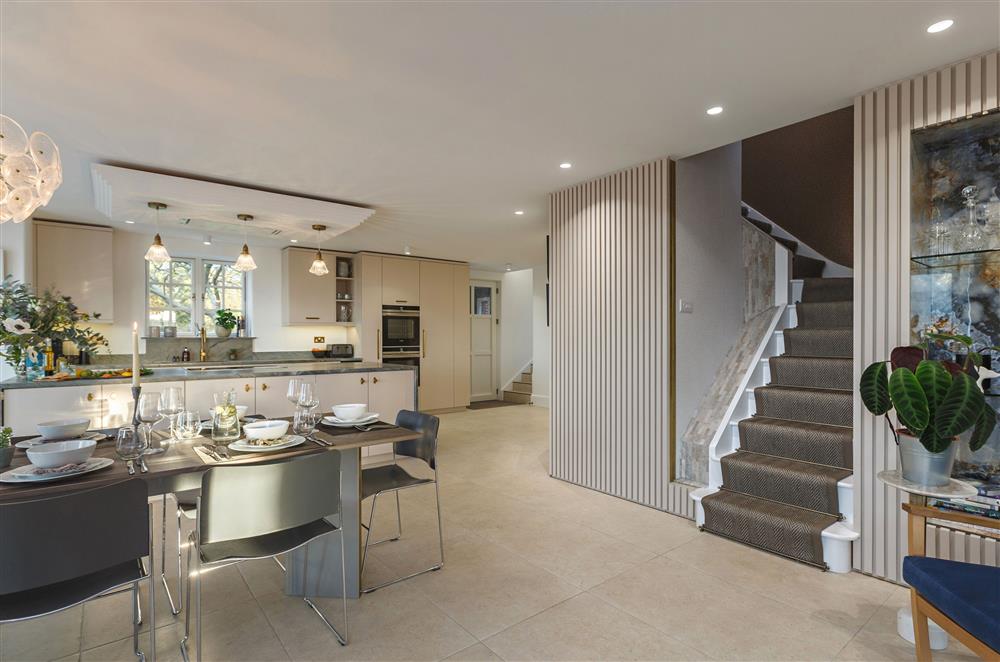 From the open-plan space, stairs lead up to the first floor and bedroom one at The Ballroom, Blakeney
