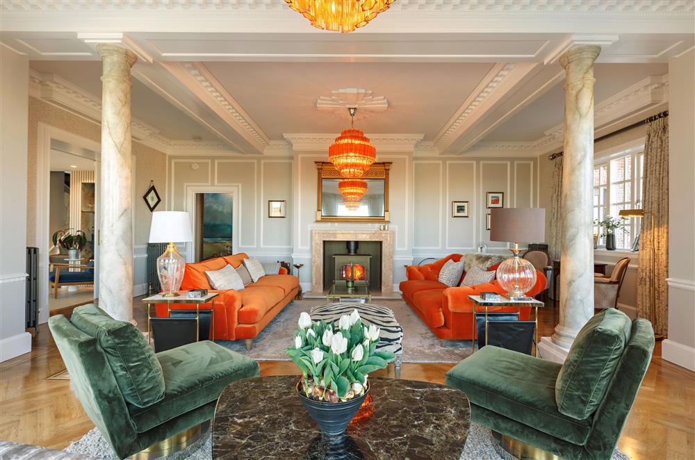 The Ballroom, Norfolk: The elegant sitting room boasts style and comfort along with a cosy wood burning stove