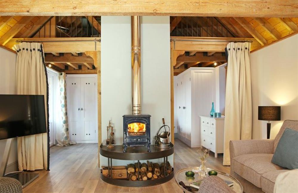 Living room and wood burner at The Barn at Banks Cottage, Pulborough, Sussex