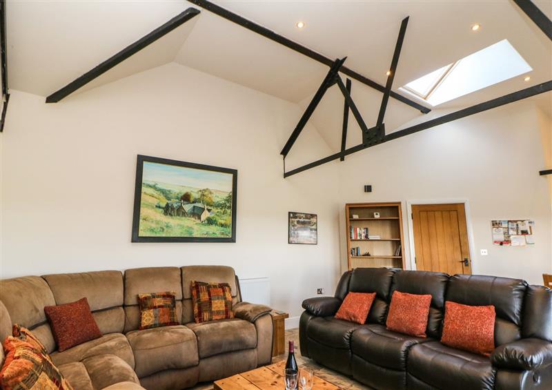 Relax in the living area at The Barn at Hill House, Leek