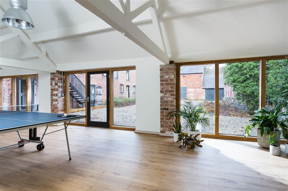 Floor-to-ceiling windows in the studio space allow natural light to flow through